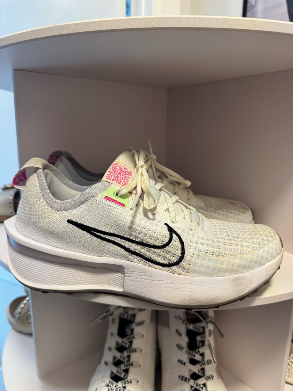 Nike White Sneakers with Black Swoosh and Pink Accents
